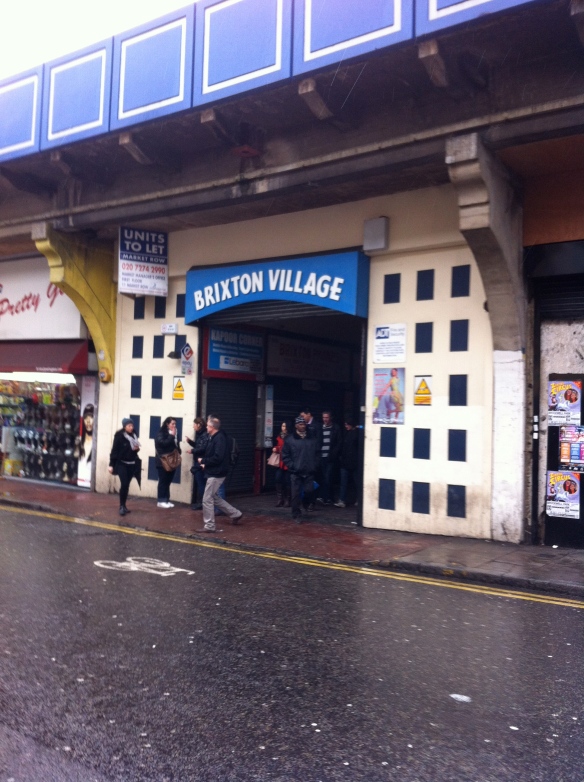 One of the unprepossessing entrances to Brixton Market's Alladin' s Cave of foodie wonders.